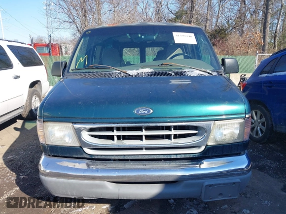 1999 Ford Econoline Cargo with VIN 1FDRE14W3XHB36482, listed as a IAAI auction lot 41393346 with 130,669 mi miles. Bid and sale history available at carsss.com. Image 12.
