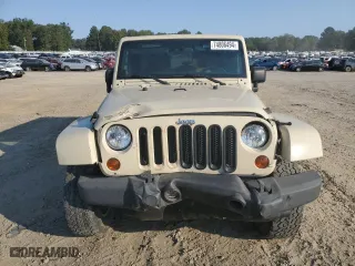 2011 Jeep Wrangler Unlimited Sahara with VIN 1J4BA5H10BL558961, listed as a Copart auction lot 74806494 with 172,855 mi miles and Salvage Title. Bid and sale history available at carsss.com. Image 5.