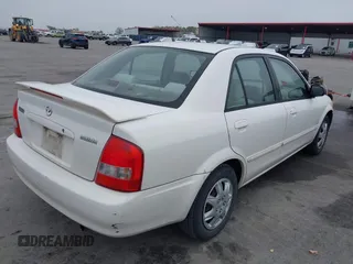 2000 Mazda Protege DX with VIN JM1BJ2220Y0273953, listed as a IAAI auction lot 41956058 with 158,837 mi miles and . Bid and sale history available at DreamBid. Image 4.