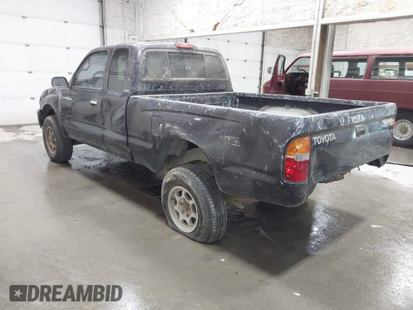 1999 Toyota Tacoma with VIN 4TAWM72N5XZ433296, listed as a IAAI auction lot 42595432 with 233,075 mi miles and . Bid and sale history available at DreamBid. Image 3.