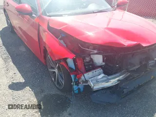 2024 Honda Civic Touring with VIN 2HGFE1F97RH302435, listed as a IAAI auction lot 42155203 with 23,494 mi miles and . Bid and sale history available at DreamBid. Image 6.