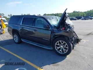 2015 GMC Yukon XL SLT z VIN 1GKS1HKC9FR145011, wystawiony jako IAAI lot #42133656 z przebiegiem Nie podano mil oraz . Historia ofert i sprzedaży dostępna na DreamBid. Obrazek 1.