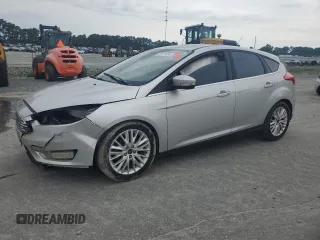 2017 Ford Focus Titanium with VIN 1FADP3N27HL251297, listed as a Copart auction lot 67373094 with 104,733 mi miles and Salvage Title. Bid and sale history available at carsss.com. Image 1.