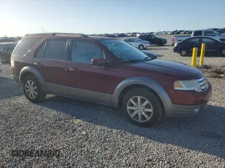 2008 Ford Taurus X SEL with VIN 1FMDK02W68GA27117, listed as a Copart auction lot 52310685 with 178,529 mi miles and Salvage Title. Bid and sale history available at DreamBid. Image 4.