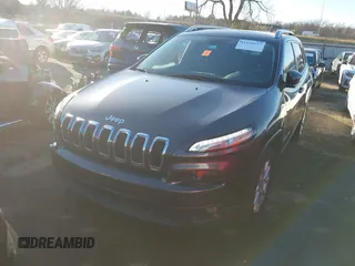 2016 Jeep Cherokee Altitude with VIN 1C4PJLCS8GW173279, listed as a IAAI auction lot 41129117 with 163,978 mi miles. Bid and sale history available at carsss.com. Image 2.
