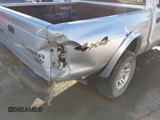 2004 Dodge Dakota Sport with VIN 1D7HG38K34S561735, listed as a IAAI auction lot 41409622 with Not Provided miles and . Bid and sale history available at carsss.com. Image 17.