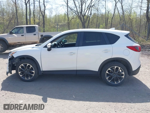 2016 Mazda CX-5 Grand Touring with VIN JM3KE4DY0G0632693, listed as a IAAI auction lot 42123142 with 106,592 mi miles. Bid and sale history available at carsss.com. Image 14.