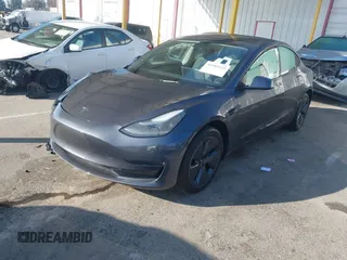 2023 Tesla Model 3 with VIN 5YJ3E1EA5PF697201, listed as a IAAI auction lot 41589422 with 16,862 mi miles and . Bid and sale history available at carsss.com. Image 2.
