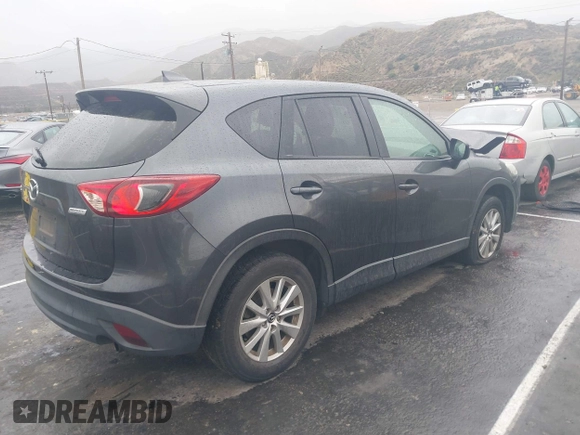 2016 Mazda CX-5 Touring with VIN JM3KE2CY7G0630056, listed as a IAAI auction lot 41817525 with 97,844 mi miles and . Bid and sale history available at DreamBid. Image 4.