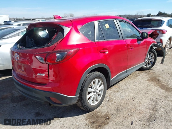 2014 Mazda CX-5 Touring z VIN JM3KE2CY2E0364488, wystawiony jako IAAI lot #41635188 z przebiegiem 127 688 mil mil oraz . Historia ofert i sprzedaży dostępna na DreamBid. Obrazek 4.
