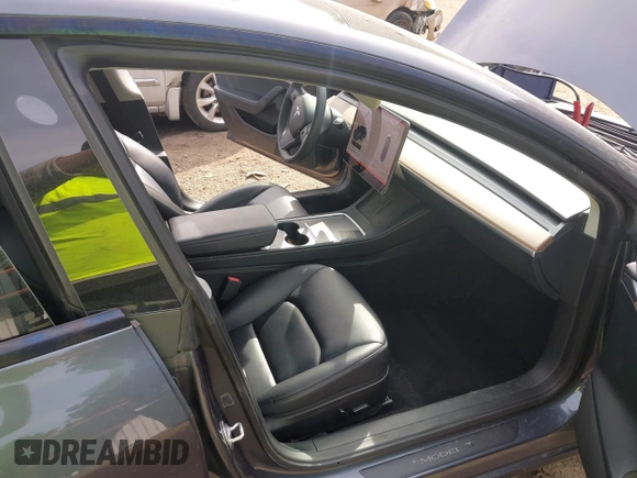 2023 Tesla Model 3 with VIN 5YJ3E1EA6PF567170, listed as a IAAI auction lot 41837040 with 36,193 mi miles and . Bid and sale history available at DreamBid. Image 5.