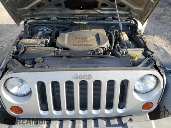 2012 Jeep Wrangler Sport z VIN 1C4AJWAG3CL260122, wystawiony jako Copart lot #54404815 z przebiegiem Nie podano mil oraz Szkoda całkowita • Salvage title. Historia ofert i sprzedaży dostępna na DreamBid. Obrazek 11.