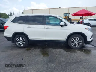 2016 Honda Pilot EX-L with VIN 5FNYF5H50GB043294, listed as a IAAI auction lot 41930654 with 92,728 mi miles and . Bid and sale history available at DreamBid. Image 13.