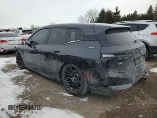2022 BMW iX xDrive50 with VIN WB523CF05NCJ43021, listed as a Copart auction lot 87864125 with 28,976 mi miles and Salvage Title. Bid and sale history available at carsss.com. Image 2.