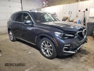 2021 BMW X5 xDrive40i with VIN 5UXCR6C06M9E05140, listed as a Copart auction lot 52402475 with 47,869 mi miles and Salvage title. Bid and sale history available at DreamBid. Image 4.