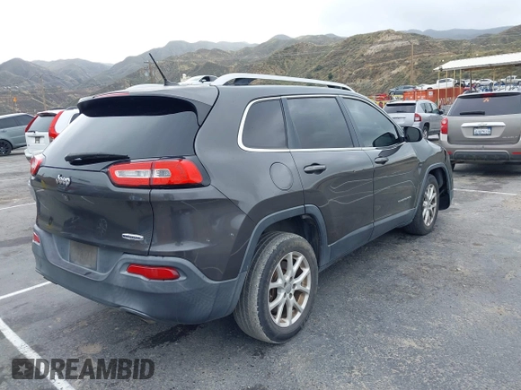 2014 Jeep Cherokee Latitude z VIN 1C4PJLCS2EW217130, wystawiony jako IAAI lot #41782039 z przebiegiem 129 080 mil mil oraz . Historia ofert i sprzedaży dostępna na DreamBid. Obrazek 4.