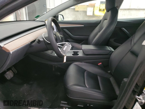 2023 Tesla Model 3 with VIN 5YJ3E1EA8PF451324, listed as a Copart auction lot 88318475 with 74,582 mi miles and Salvage Title. Bid and sale history available at DreamBid. Image 7.
