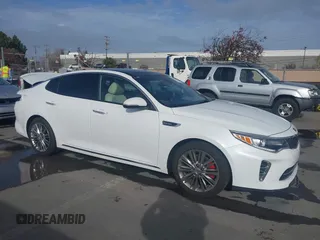 2016 Kia Optima SXL Turbo with VIN 5XXGV4L20GG074869, listed as a IAAI auction lot 41212808 with 82,884 mi miles. Bid and sale history available at carsss.com. Image 1.