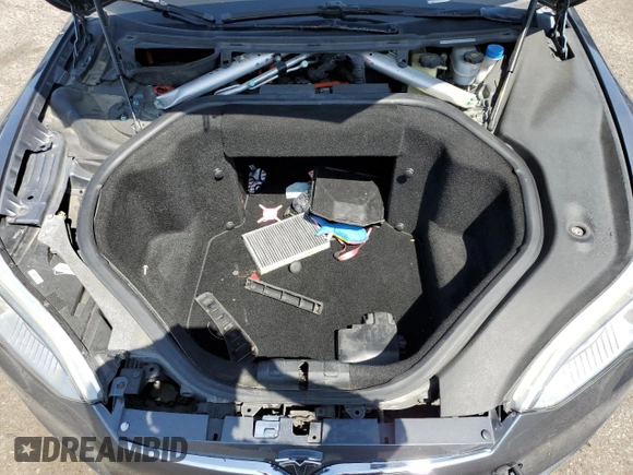 2014 Tesla Model S 60 z VIN 5YJSA1H17EFP36595, wystawiony jako Copart lot #53705035 z przebiegiem 148 254 mil mil oraz Szkoda całkowita • Salvage title. Historia ofert i sprzedaży dostępna na DreamBid. Obrazek 11.