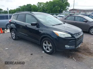 2014 Ford Escape SE z VIN 1FMCU0GX6EUC61410, wystawiony jako IAAI lot #42436644 z przebiegiem 154 917 mil mil oraz . Historia ofert i sprzedaży dostępna na DreamBid. Obrazek 1.
