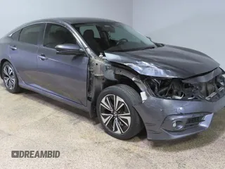 2017 Honda Civic EX-L z VIN 2HGFC1F70HH645185, wystawiony jako Copart lot #58595415 z przebiegiem 132 384 mil mil oraz Czysty tytuł • Clean title. Historia ofert i sprzedaży dostępna na DreamBid. Obrazek 1.