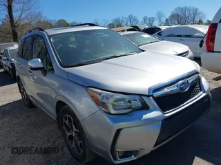 2016 Subaru Forester 2.0XT Touring with VIN JF2SJGXC0GH501014, listed as a IAAI auction lot 41667438 with 150,983 mi miles. Bid and sale history available at carsss.com. Image 1.