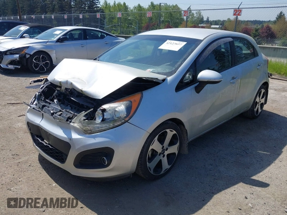 2014 Kia Rio SX with VIN KNADN5A31E6353714, listed as a IAAI auction lot 42127657 with 117,544 mi miles. Bid and sale history available at carsss.com. Image 2.