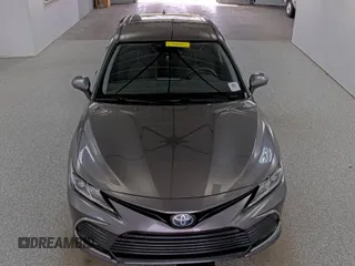 2021 Toyota Camry Hybrid LE with VIN 4T1C31AK5MU021219, listed as a IAAI auction lot 42098556 with 107,707 mi miles. Bid and sale history available at carsss.com. Image 1.
