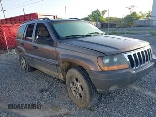 2002 Jeep Grand Cherokee with VIN 1J4GW38N42C202219, listed as a IAAI auction lot 42035162 with 220,012 mi miles and . Bid and sale history available at DreamBid. Image 1.