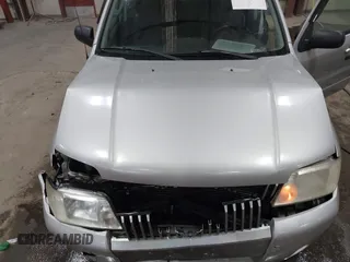 2007 Mercury Mariner Premier z VIN 4M2CU97197KJ06878, wystawiony jako IAAI lot #41033843 z przebiegiem 139 492 mil mil oraz . Historia ofert i sprzedaży dostępna na DreamBid. Obrazek 10.