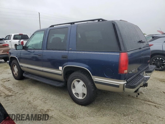 1999 GMC Yukon with VIN 1GKEK13R2XJ739931, listed as a Copart auction lot 74583734 with 115,605 mi miles and Salvage Title. Bid and sale history available at carsss.com. Image 2.