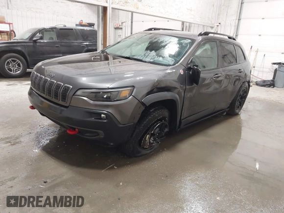 2022 Jeep Cherokee Trailhawk z VIN 1C4PJMBX9ND514703, wystawiony jako IAAI lot #41761037 z przebiegiem 38 499 mil mil oraz . Historia ofert i sprzedaży dostępna na DreamBid. Obrazek 2.