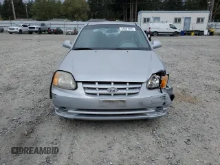 2005 Hyundai Accent GLS z VIN KMHCG45C75U639281, wystawiony jako Copart lot #54887095 z przebiegiem 136 090 mil mil oraz Szkoda całkowita • Salvage title. Historia ofert i sprzedaży dostępna na DreamBid. Obrazek 5.