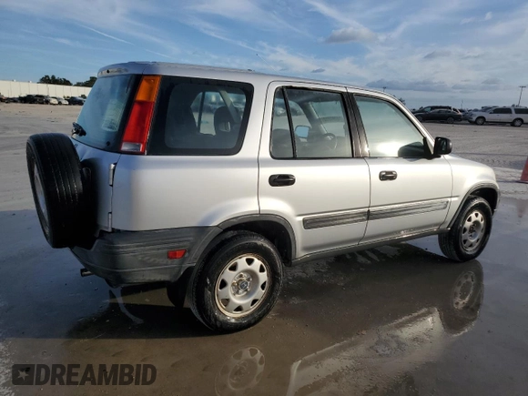 1999 Honda CR-V LX with VIN JHLRD2844XC016583, listed as a Copart auction lot 73747274 with 104,730 mi miles and Salvage Title. Bid and sale history available at carsss.com. Image 3.