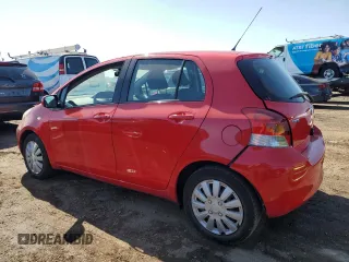 2009 Toyota Yaris with VIN JTDKT903095246576, listed as a Copart auction lot 52150915 with 90,276 mi miles and Salvage Title. Bid and sale history available at DreamBid. Image 2.