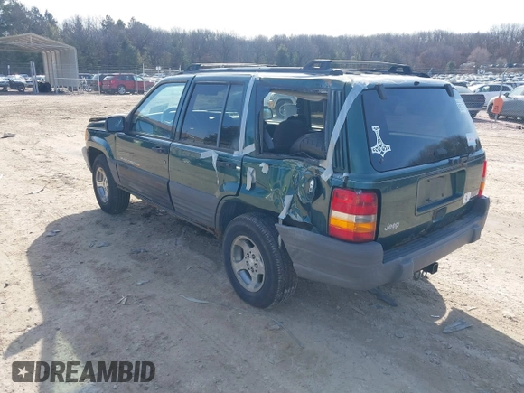 1997 Jeep Grand Cherokee Laredo with VIN 1J4GZ58S2VC595442, listed as a IAAI auction lot 41772133 with 229,764 mi miles. Bid and sale history available at carsss.com. Image 3.