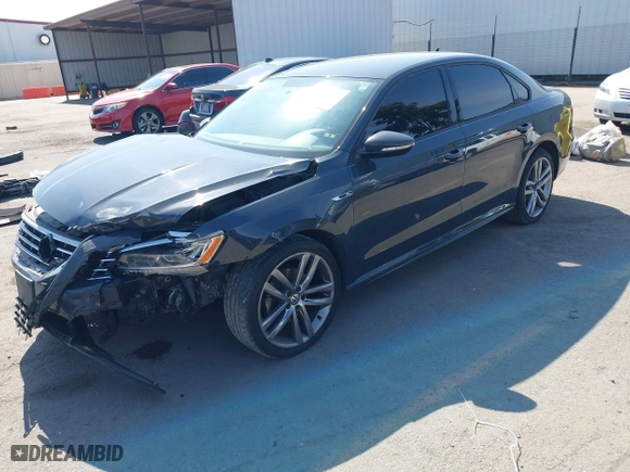 2018 Volkswagen Passat 2.0T S with VIN 1VWAA7A34JC025600, listed as a IAAI auction lot 41594079 with 92,019 mi miles. Bid and sale history available at carsss.com. Image 2.