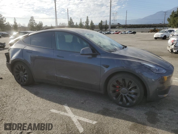 2022 Tesla Model Y Performance with VIN 7SAYGDEF3NF490643, listed as a Copart auction lot 46975825 with 50,792 mi miles and Salvage Title. Bid and sale history available at DreamBid. Image 4.