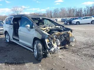 2017 Chrysler Pacifica Touring L with VIN 2C4RC1BGXHR794828, listed as a IAAI auction lot 41213132 with Not Provided miles and . Bid and sale history available at DreamBid. Image 1.