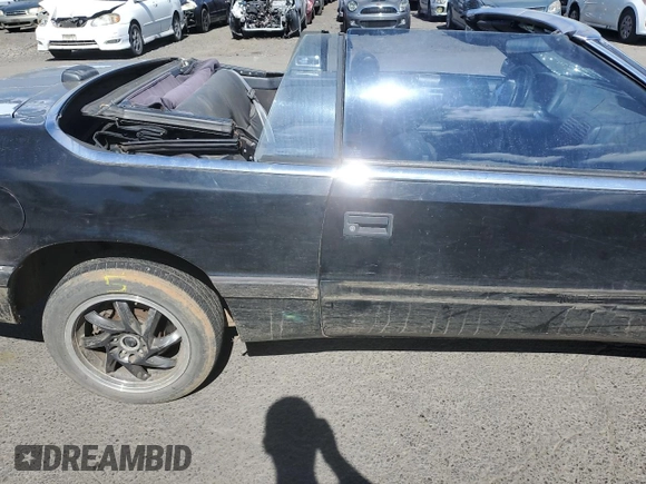 1992 Chrysler LeBaron z VIN 1C3XU4537NF129794, wystawiony jako Copart lot #71594804 z przebiegiem 156 624 mil mil oraz Szkody całkowita. Historia ofert i sprzedaży dostępna na DreamBid. Obrazek 11.