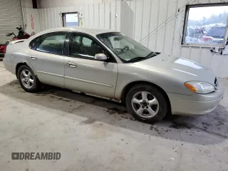 2003 Ford Taurus SE Standard z VIN 1FAFP532X3A195612, wystawiony jako Copart lot #54016645 z przebiegiem 143 168 mil mil oraz Szkoda całkowita • Salvage title. Historia ofert i sprzedaży dostępna na DreamBid. Obrazek 4.