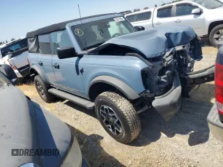 2023 Ford Bronco z VIN 1FMDE5BHXPLA99837, wystawiony jako Copart lot #56073885 z przebiegiem 9 679 mil mil oraz Szkoda całkowita • Salvage title. Historia ofert i sprzedaży dostępna na DreamBid. Obrazek 4.