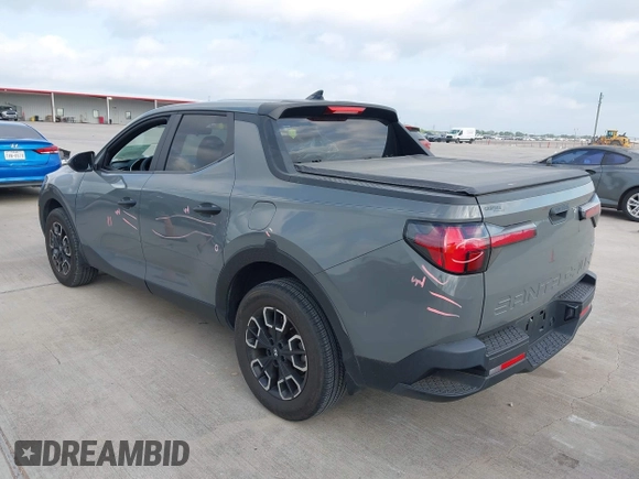 2022 Hyundai Santa Cruz SEL with VIN 5NTJBDAE4NH022823, listed as a IAAI auction lot 42051616 with 23,158 mi miles and . Bid and sale history available at DreamBid. Image 3.