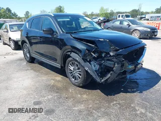 2019 Mazda CX-5 Touring with VIN JM3KFBCM9K0597631, listed as a IAAI auction lot 42054662 with 107,098 mi miles. Bid and sale history available at carsss.com. Image 1.