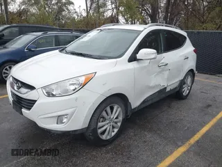 2013 Hyundai Tucson GLS with VIN KM8JU3AC4DU675511, listed as a IAAI auction lot 40765852 with 147,061 mi miles. Bid and sale history available at carsss.com. Image 2.