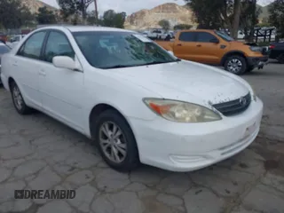 2004 Toyota Camry LE with VIN 4T1BF32K84U065969, listed as a IAAI auction lot 41936434 with 198,886 mi miles. Bid and sale history available at carsss.com. Image 1.