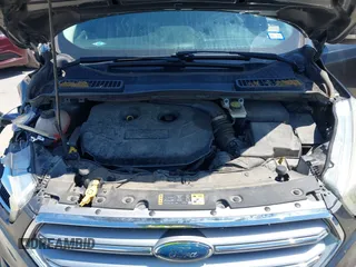 2017 Ford Escape Titanium with VIN 1FMCU0J97HUE07747, listed as a IAAI auction lot 41977788 with 104,560 mi miles. Bid and sale history available at carsss.com. Image 10.