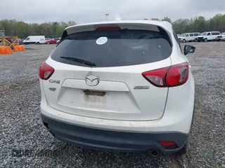2015 Mazda CX-5 Touring with VIN JM3KE2CY4F0436664, listed as a IAAI auction lot 41876238 with 374,305 mi miles. Bid and sale history available at carsss.com. Image 16.