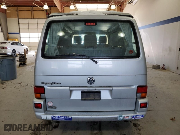 2003 Volkswagen EuroVan MV с VIN WV2NB47073H001005, выставлен на аукционе Copart как лот 87284844 с пробегом 283 979 миль миль и Чистый • Clean title. История ставок и продаж доступна на DreamBid. Изображение 6.