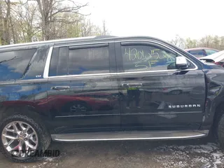 2015 Chevrolet Suburban LTZ with VIN 1GNSKKKC5FR255373, listed as a IAAI auction lot 42012528 with 219,030 mi miles and . Bid and sale history available at DreamBid. Image 13.